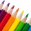 Row of colourful pencils isolated over white background